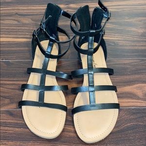 Open toed black flat sandals